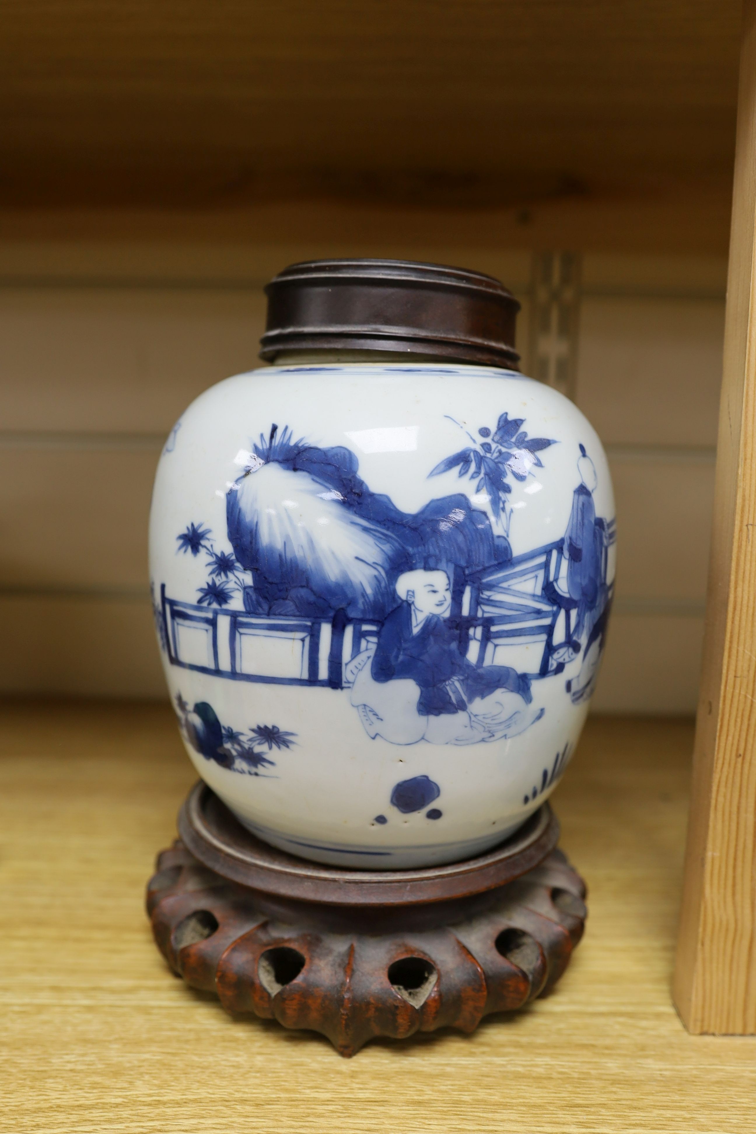 A Chinese blue and white 'boys' jar, 19th century, wood cover and stand, total height 24cm high